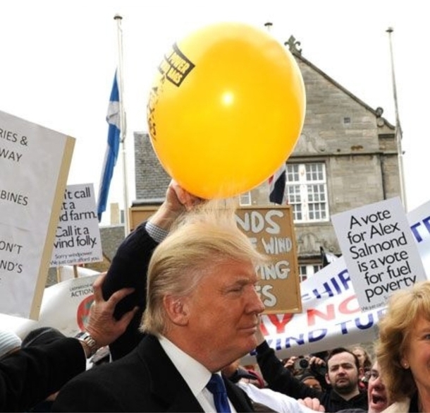 Just a Scottish protestor applying balloon static to Donald Trumps hairpiece