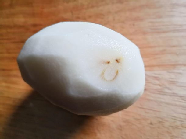 Just peeled this potato and it revealed a happy face