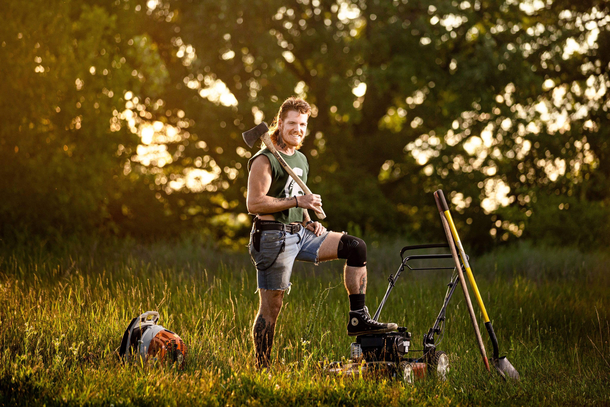 landscaper has photoshoot with his lawn equipment