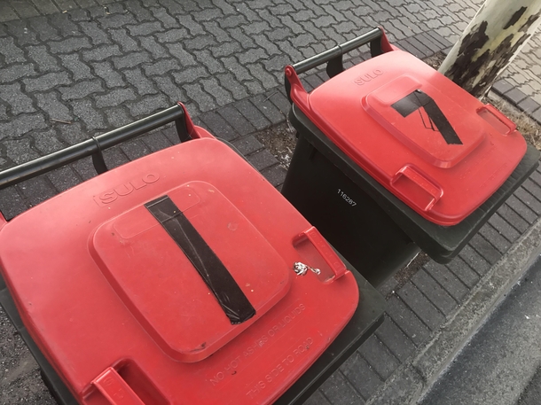 Last week I put a piece of tape on my bin lid to fix a crack My  year old neighbor obviously thought we were labelling our bins with our unit numbers