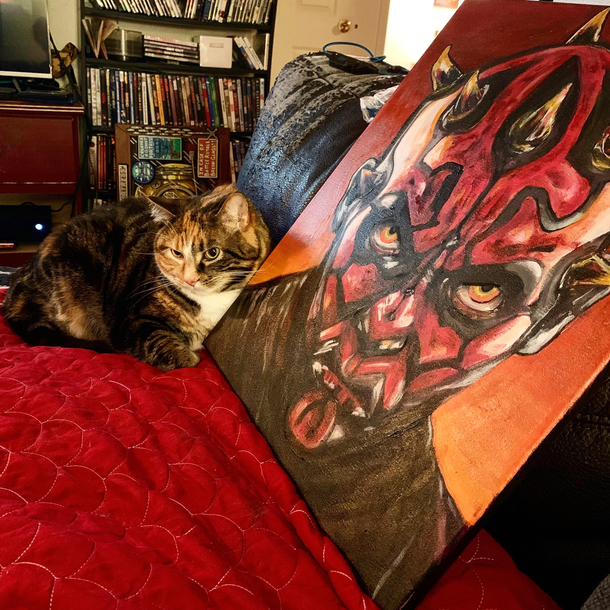 Left a painting on the couch and came back to see that my mood cat found her spirit creature