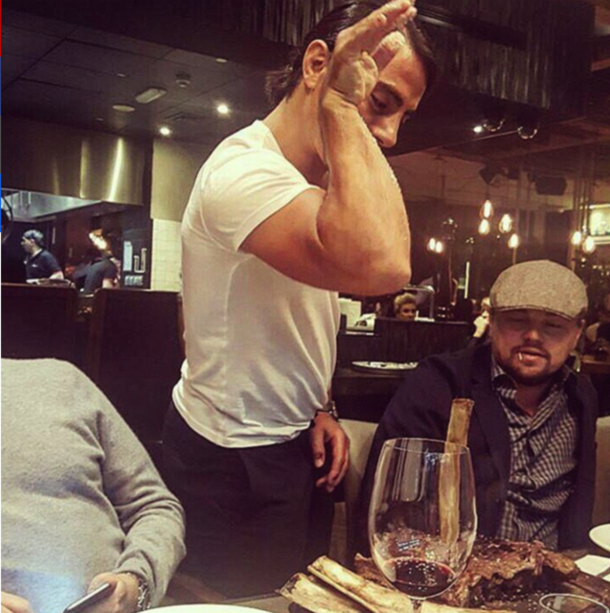 Leonardo Di Caprio getting his steak salted by Salt Bae