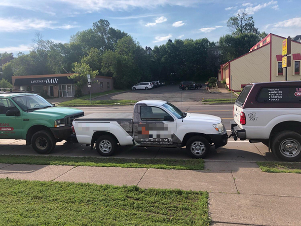Little friendly competition between neighboring roofing companies by my house That truck has been stuck there for  hours