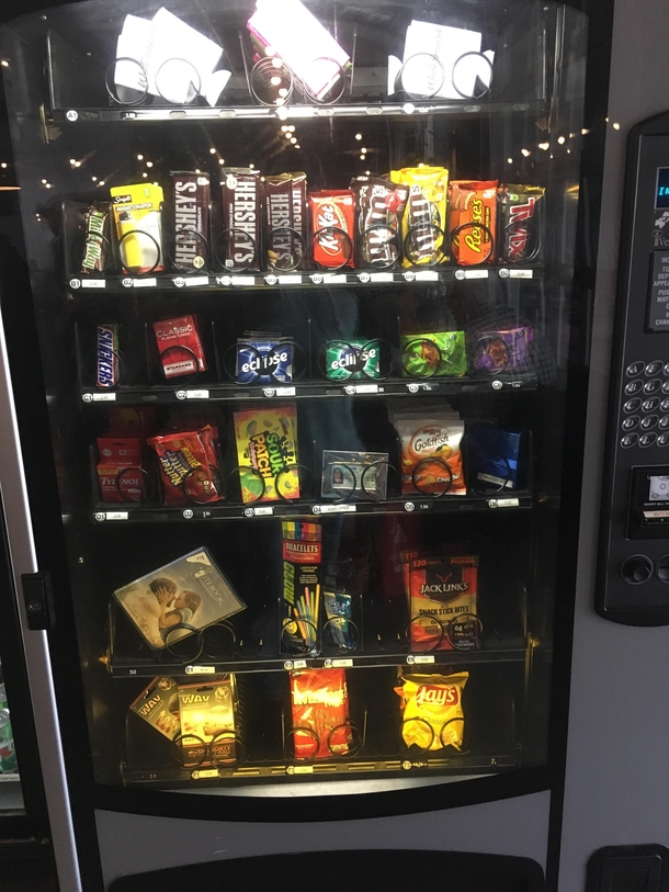 Local brewerys vending machine has beer koozies pregnancy tests and The Notebook dvd