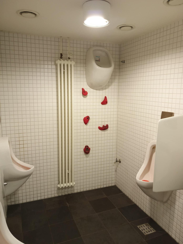 Mens bathroom inside a rock climbing gym