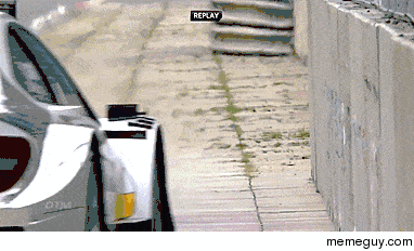 Mercedes DTM Car Gracefully Skimming a Concrete Barricade
