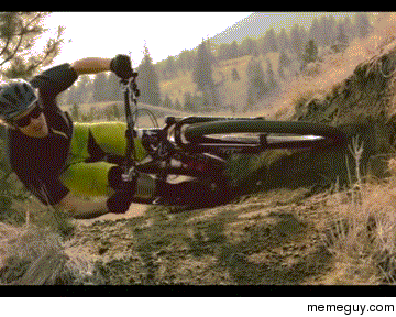 Mountain biker cornering extremely low