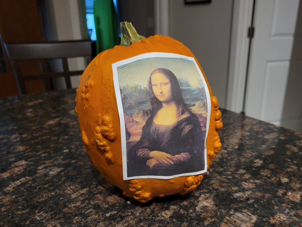 My apartment building is having a pumpkin decorating contest so I stapled the Mona Lisa to a gourd