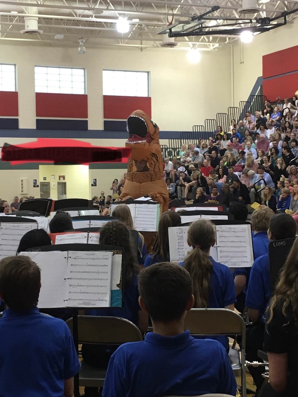 My band director wore a T-Rex suit At a concert during a performance While conducting in it