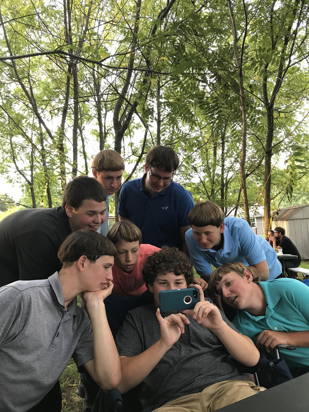 My brother and Amish cousins watching a YouTube video