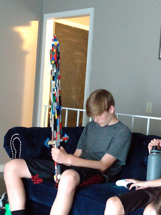 My brother built a Lego sword now hes playing on his phone What a legend