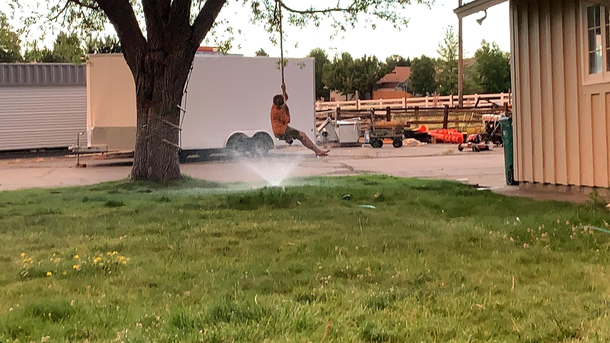 My brother got stuck on a swing so I put the hose underneath him like a good brother would