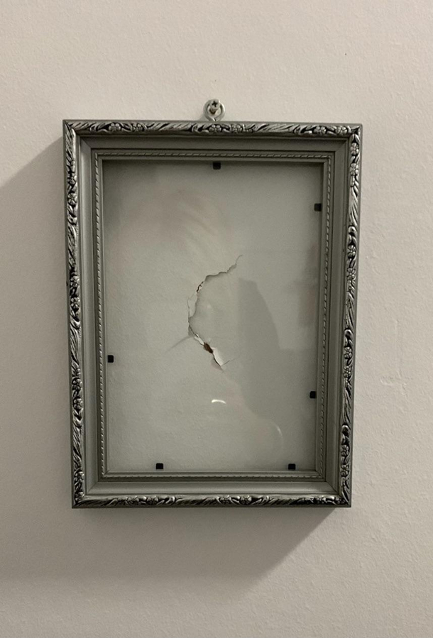 My brother punched a hole in the wall so my mum framed it