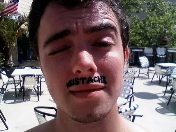 My buddy jokingly decided to get a henna tattoo of a mustache while at the beach The foreign worker didnt understand what he was saying so she asked him to write down what he wanted This was the result