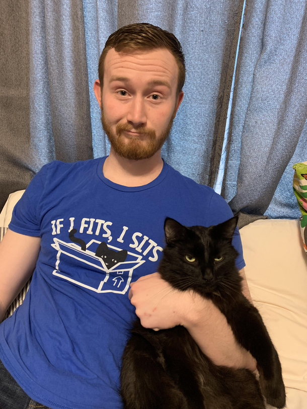 My cat is completely unamused by the cat shirt