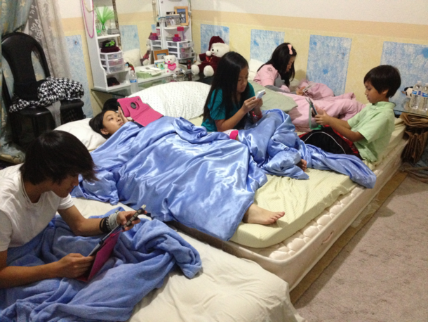 My cousins enjoying their sleepover party