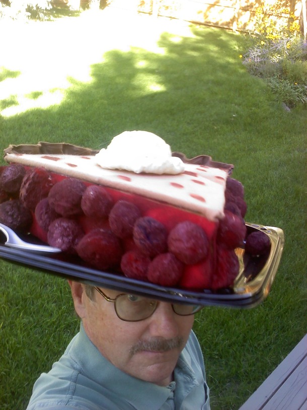 My dad loves ridiculous hats For his churchs cherry pie sale fundraiser he decided to make one of his own