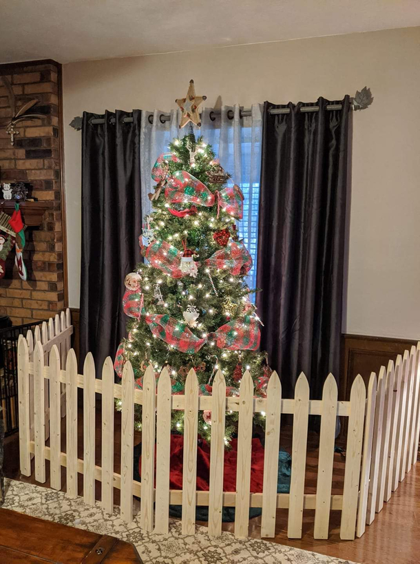 My Dad made a little fence for my Moms Christmas tree because her dog keeps trying to eat the gifts and ornaments