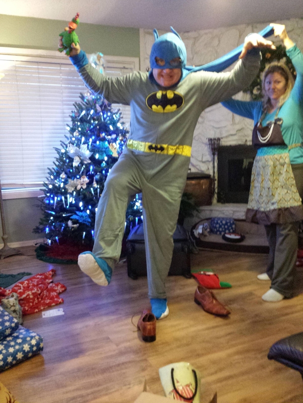My dad made my mom hold his cape for his Christmas jammies pic