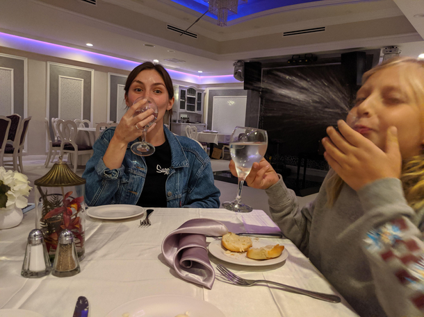 My daughter and girlfriend trying to act proper in an quiet upscale Italian restaurant last night