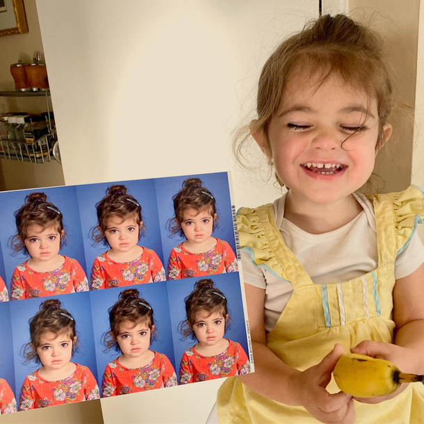 My daughter smiling only after her first ever school photos came in