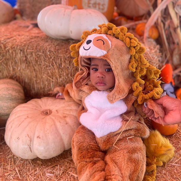 My daughter was supposed to be a lion for Halloween We couldnt find a costume in time so we added a fake mane to a sloth costume 