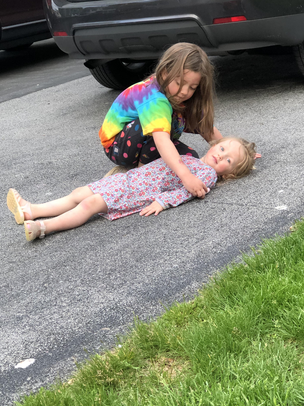 My daughters wanted to play with chalk outside I came out to them setting up a fake crime scene