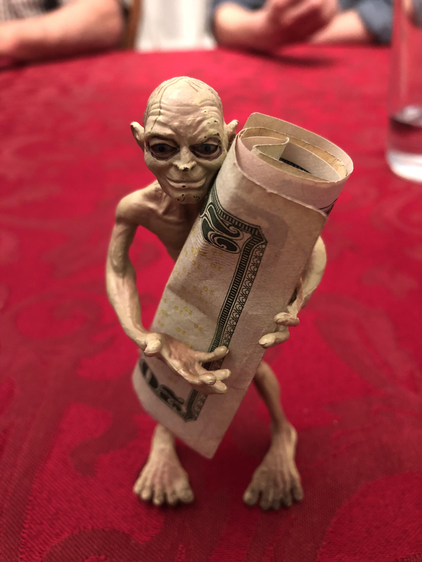 My family and I use this Gollum toy to hold the money when we play cards