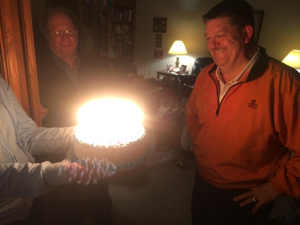 My family celebrated my Dads th birthday today Im away at school and my brother sent me this pic Apparently  years of candles is enough to give birth to a protostar