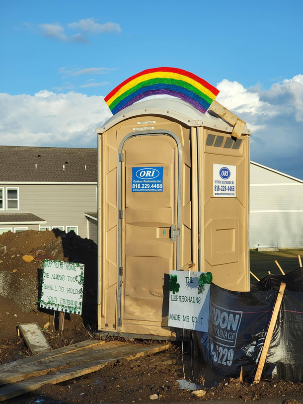 My father-in-law decorates an outhouse builders left next to his property