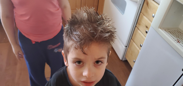 My four year old was just caught cutting his own hair with scissors that were suppose to be out of reach I pulled out my phone to call my wife and he screams Dont call the police