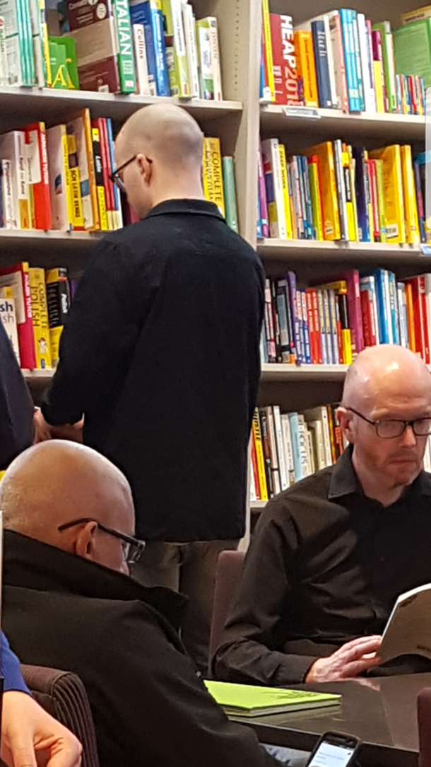 My friend and I went to a bookshop and the matrix glitched hes the bald dude in black and glasses