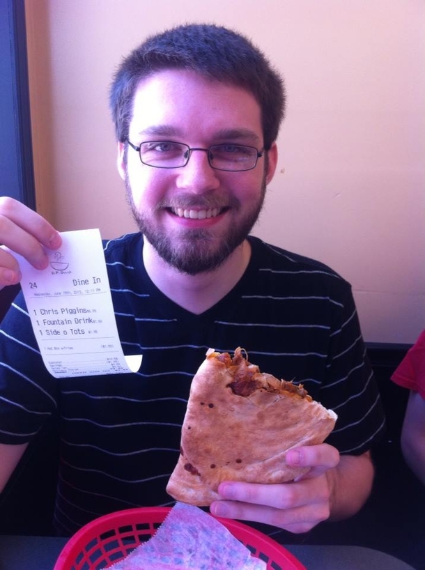 My friend Chris Higgins recently got a mac-and-cheesepulled-pork calzone named after him via a social media contest Here he is eating himself for the first time