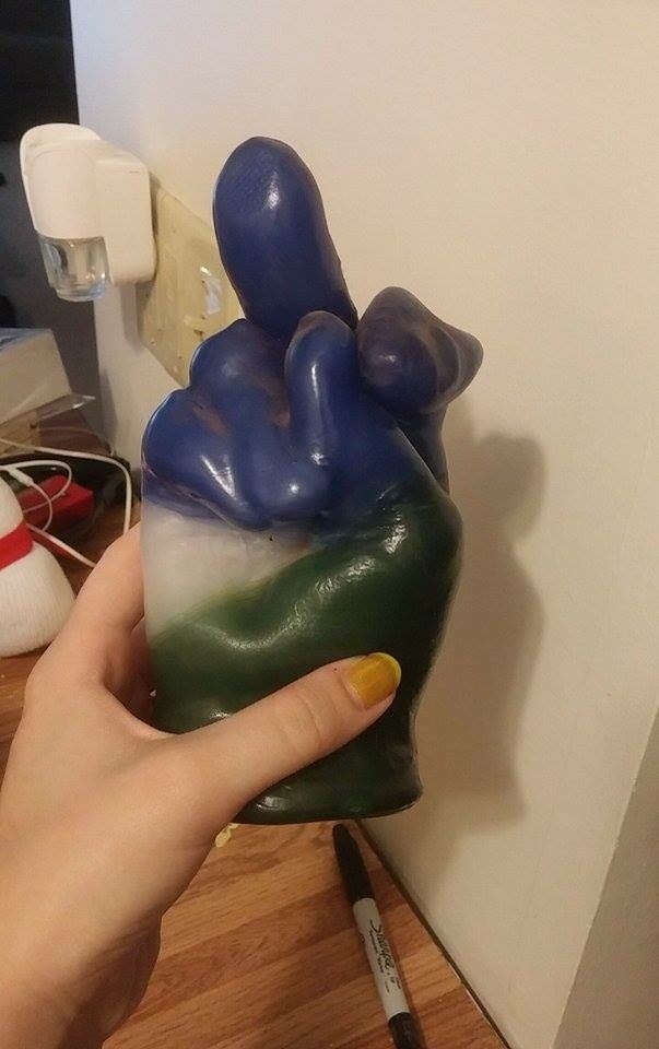 My friend had a peace sign wax sculpture It melted a bit