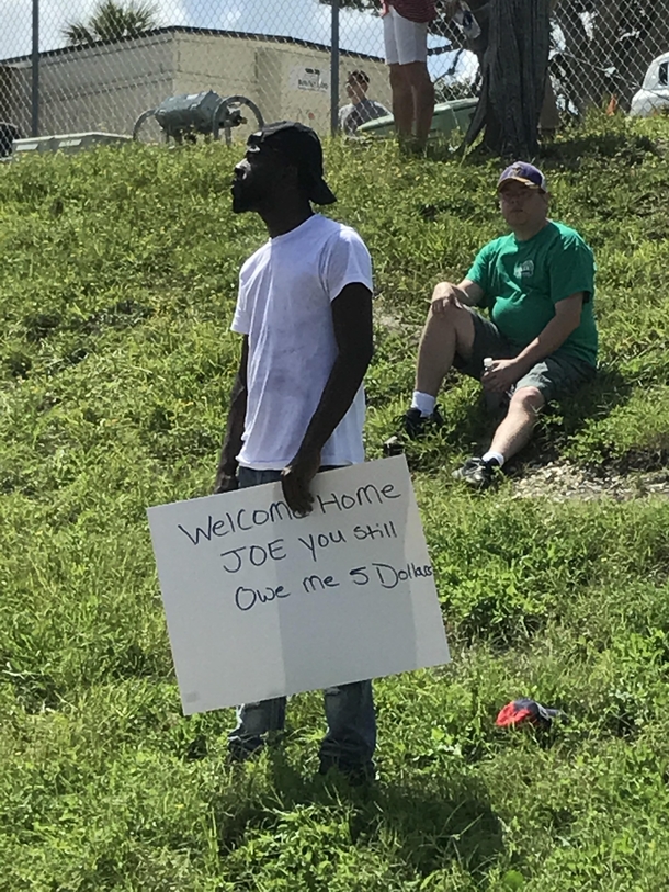 My friend just returned from a  month deployment This guy had my favorite sign in the crowd of friends and family