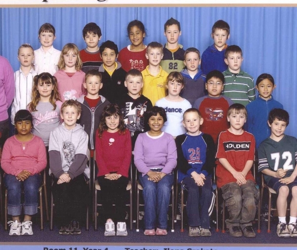 My friends class photo from Primary school hes the one at the bottom right wearing the  shirt