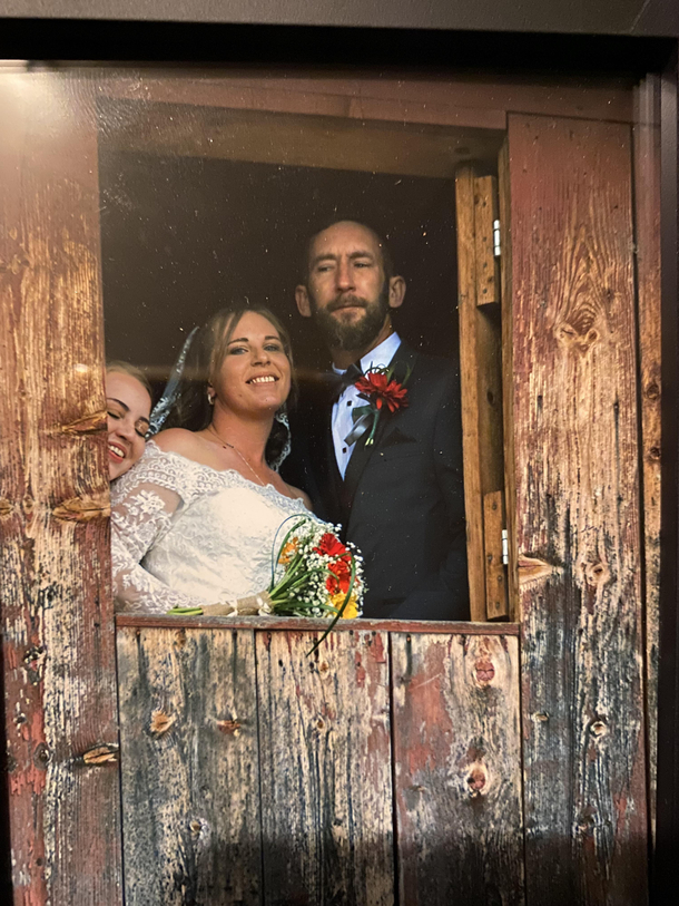 My friends got married Did NOT know they were taking a photo in the window and photobombed the pic