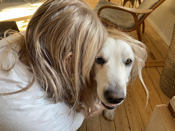 My girlfriend hugging my dog makes it look like he has a dumb haircut