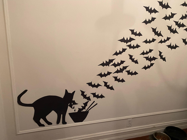 My girlfriend wanted more halloween decorations so I got creative with the black construction paper I present my COVID cat halloween wall silhouette