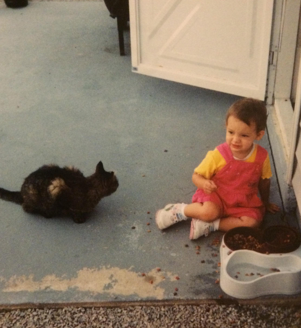 My grandparents decided to take a photo of me eating their cats food while their cat judged me the entire time