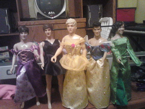 My little sister made me help her put her One Direction dolls in dresses