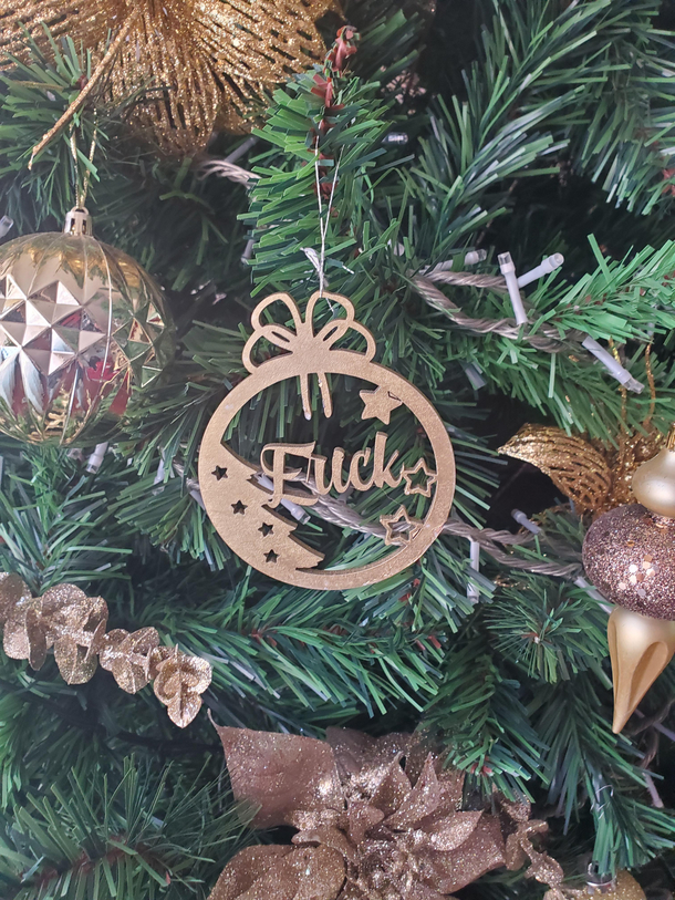 My MIL had wooden laser cut ornaments made for each of her children and grandchildren this year The ornament for Erick didnt turn out as planned