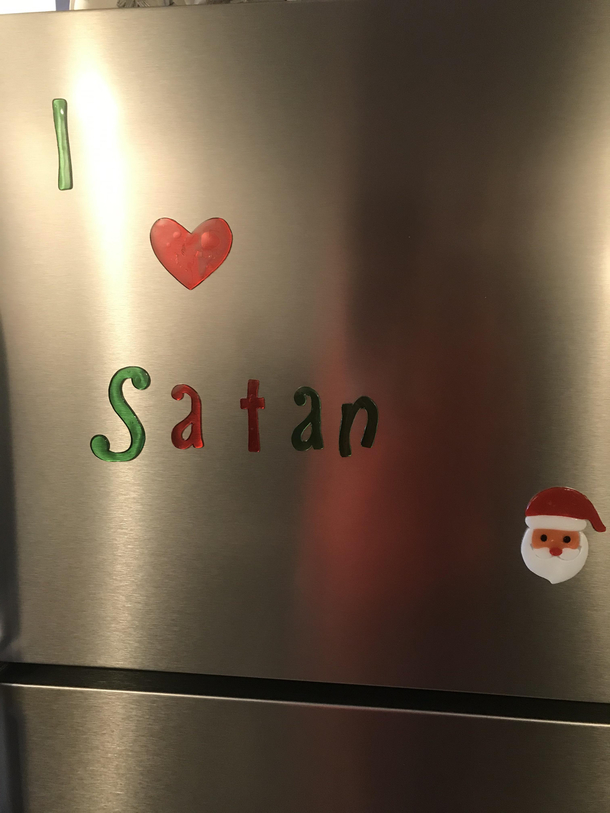 My mom has sticky letters on her fridge that said I heart Santa I decided to do a little redecorating