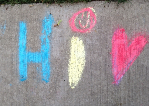 My neighbors kid wanted to write Hi and a heart in sidewalk chalk I see something else