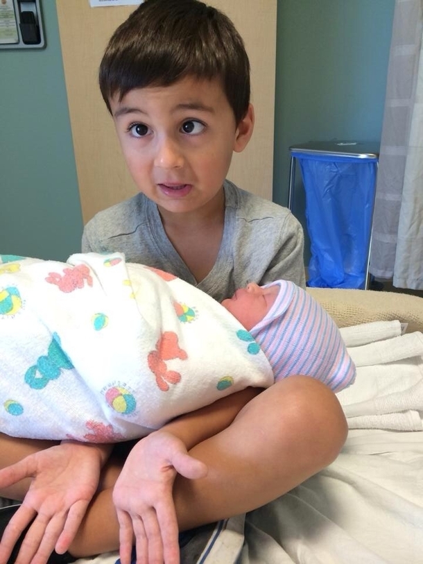 My nephew holding his baby sister for the first time As a single guy it reminded me of what its like to hold someones baby