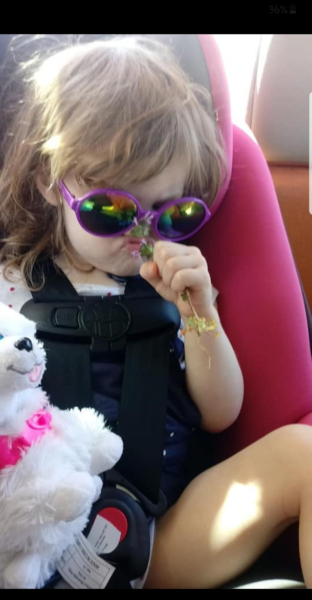 My niece intensely smelling this flower