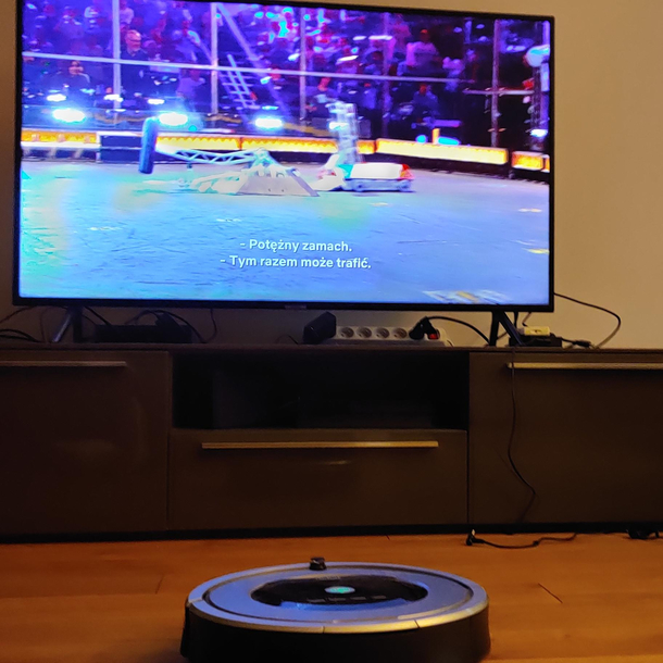 My Roomba watching BattleBots One day she will start in competition