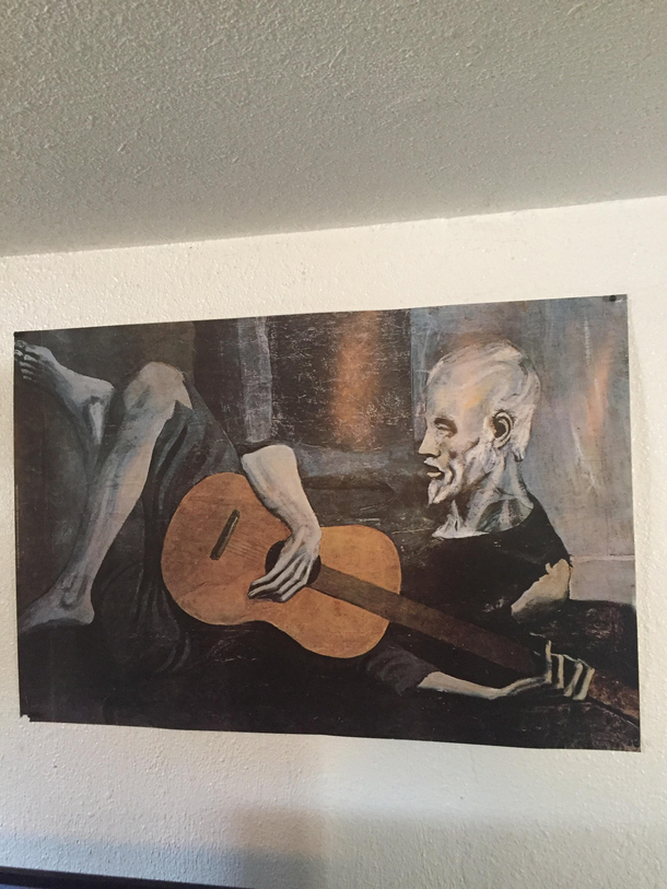 My roommate got tired of looking at the sad guitarist so he turned it and made the chill guitarist I like it better