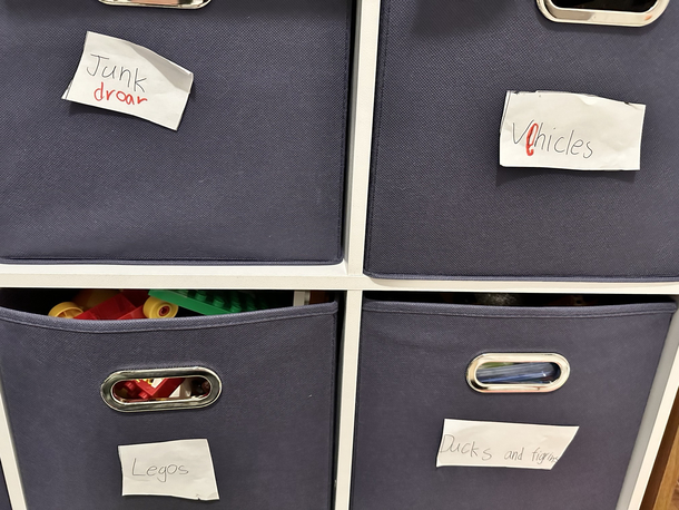 My sons labeled one of his storage cubbies Junk droar