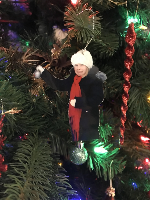 My step-daughter had a melt down while taking Christmas pictures a few years ago so I made this ornament that we now hang on the tree every year